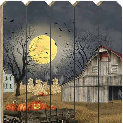 Halloween-themed wall art with pumpkins, barn, and full moon on wooden panels.
