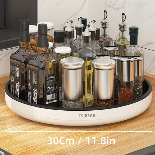 A 360-degree rotating white kitchen organizer with a selection of bottles and containers on a circular base, placed on a kitchen counter.