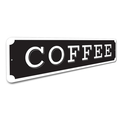 Black sign with 'COFFEE' in white letters on a white background