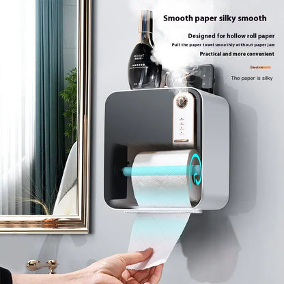 Wall-mounted paper towel holder dispensing paper towels with text describing its features.