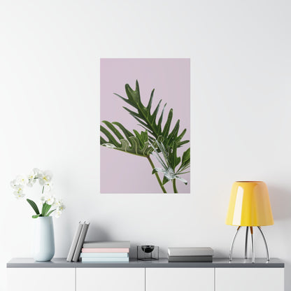 Framed plant print on a wall above a shelf with decor items.