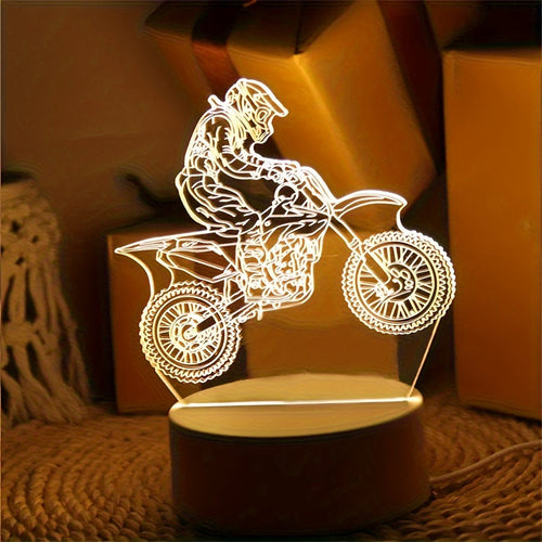 3D Motocross LED night light with a USB cord, displaying a 3D pattern of a motocross rider on a tabletop.