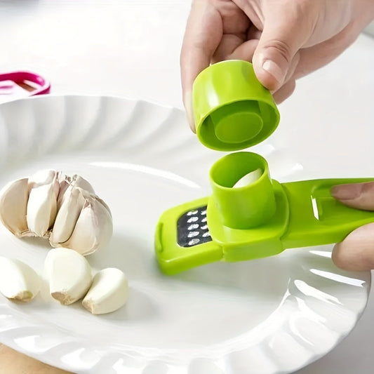 A green Compact MultiFunction Garlic Grinder Press being used to mince garlic, with the device disassembled to show the inner mechanism.