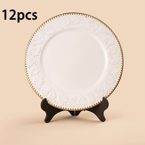 A white and gold decorative charger plate with an intricate floral pattern around the edge, measuring 33 cm (13 inches).