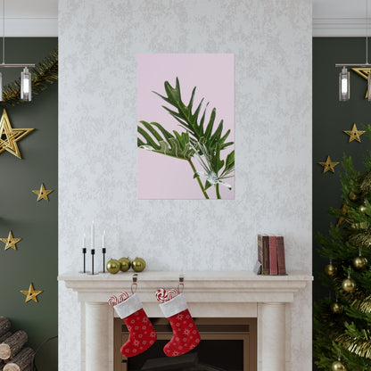 Decorative wall art above a fireplace with Christmas stockings and tree.