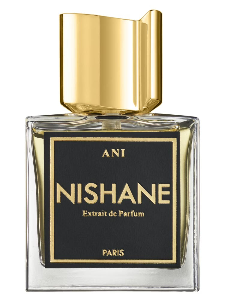 Nishane perfume bottle with gold cap and black label on a white background