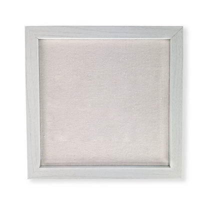White picture frame with a textured white background