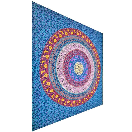 Colorful mandala tapestry with concentric circles on a blue floral background