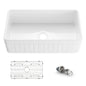 White kitchen sink with grid and drain assembly on a white background