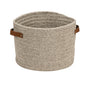 Beige woven basket with leather handles on a white background