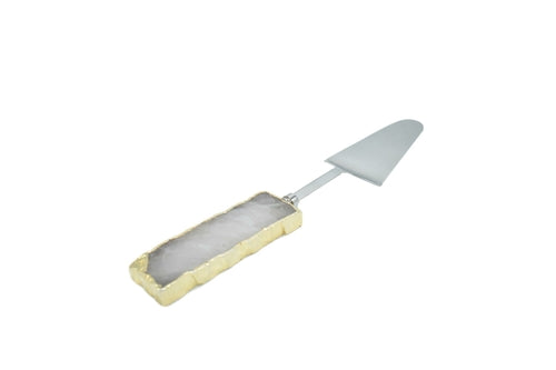 A set of three cake servers with gold trim handles and gemstone accents in amethyst, black quartz, and clear quartz.