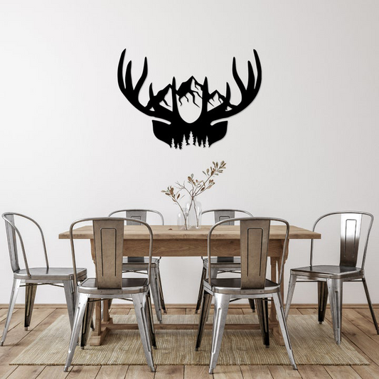 Dining room with a wooden table and chairs, featuring a large black deer antler wall decal.