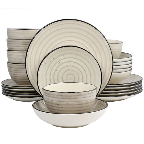 A 24 piece round stoneware dinnerware set in cream color with swirl and speckle design, including plates, bowls, and cups.