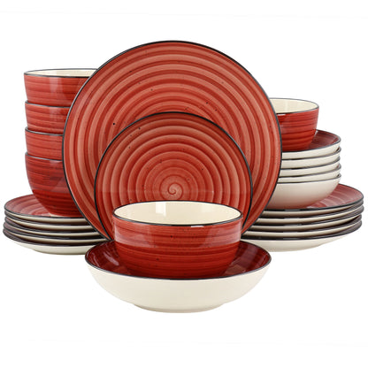 A 24 piece round stoneware dinnerware set in red with swirl and speckle design, including plates, bowls, and cups.