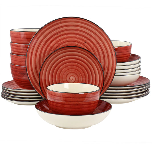A 24 piece round stoneware dinnerware set in red with swirl and speckle design, including plates, bowls, and cups.