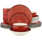 A 24 piece round stoneware dinnerware set in red with swirl and speckle design, including plates, bowls, and cups.