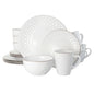 A 16 piece dinnerware set by Elama featuring a pearl and slate color scheme with a diamond shaped texture.