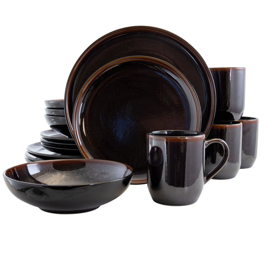 A 16 piece round stoneware dinnerware set in metallic black with brown trim, including plates, bowls, and cups.