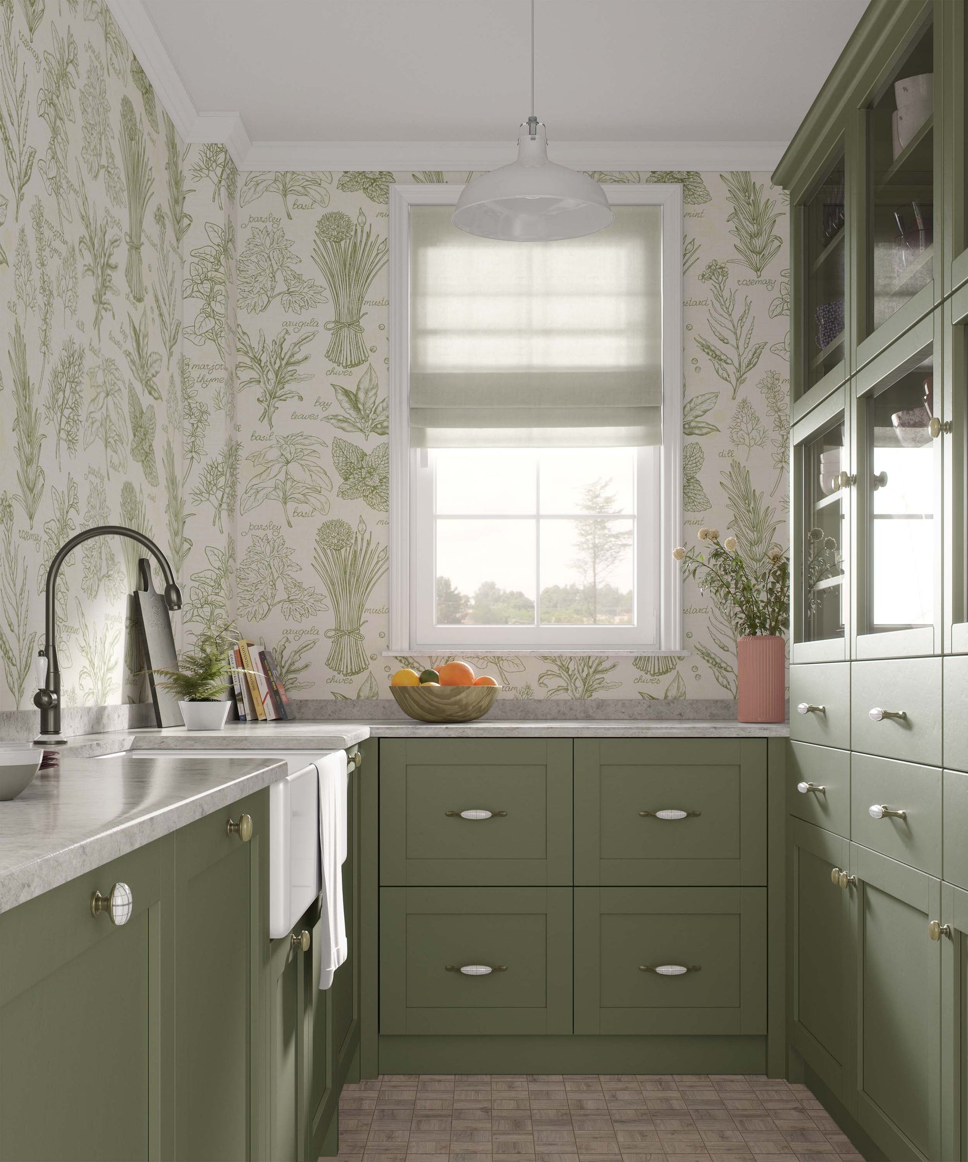 A kitchen with green cabinetry and floral wallpaper featuring images of herbs and greenery.