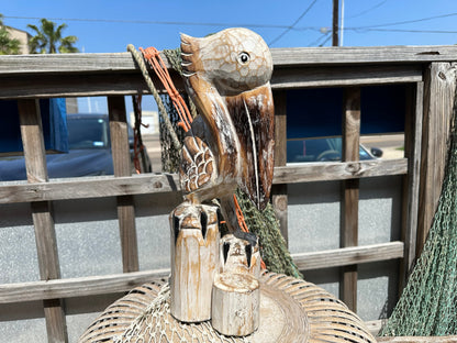 Wooden Pelican Standing on Multiple Piling Statue
