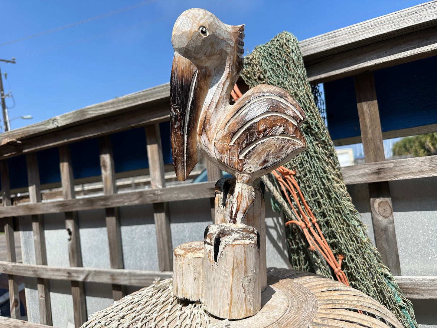 Wooden Pelican Standing on Multiple Piling Statue