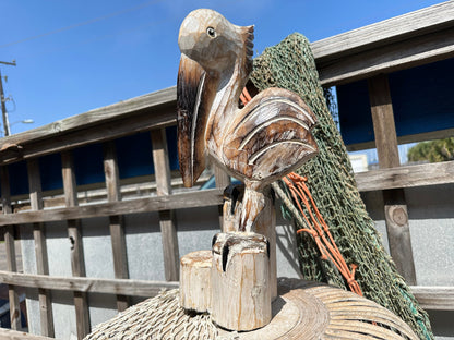 Wooden Pelican Standing on Multiple Piling Statue