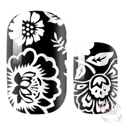 Black and white floral nail art design on a white background