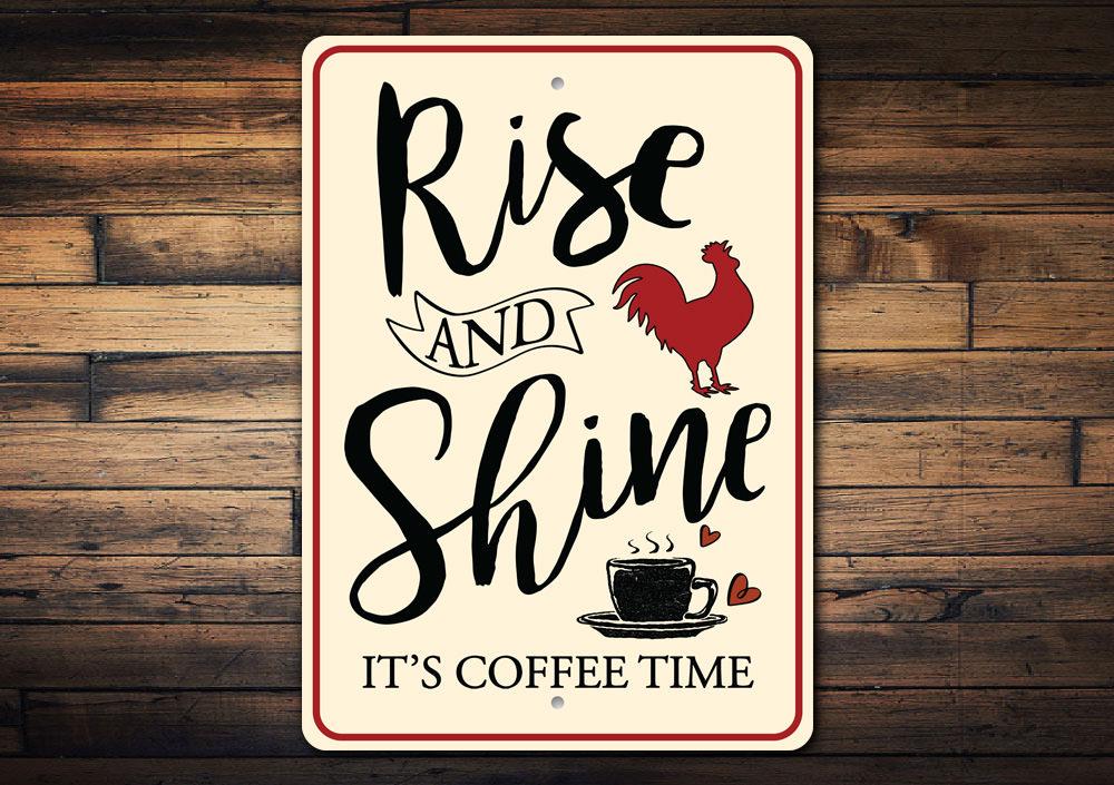 Decorative sign with 'Rise and Shine, It's Coffee Time' text on a wooden background