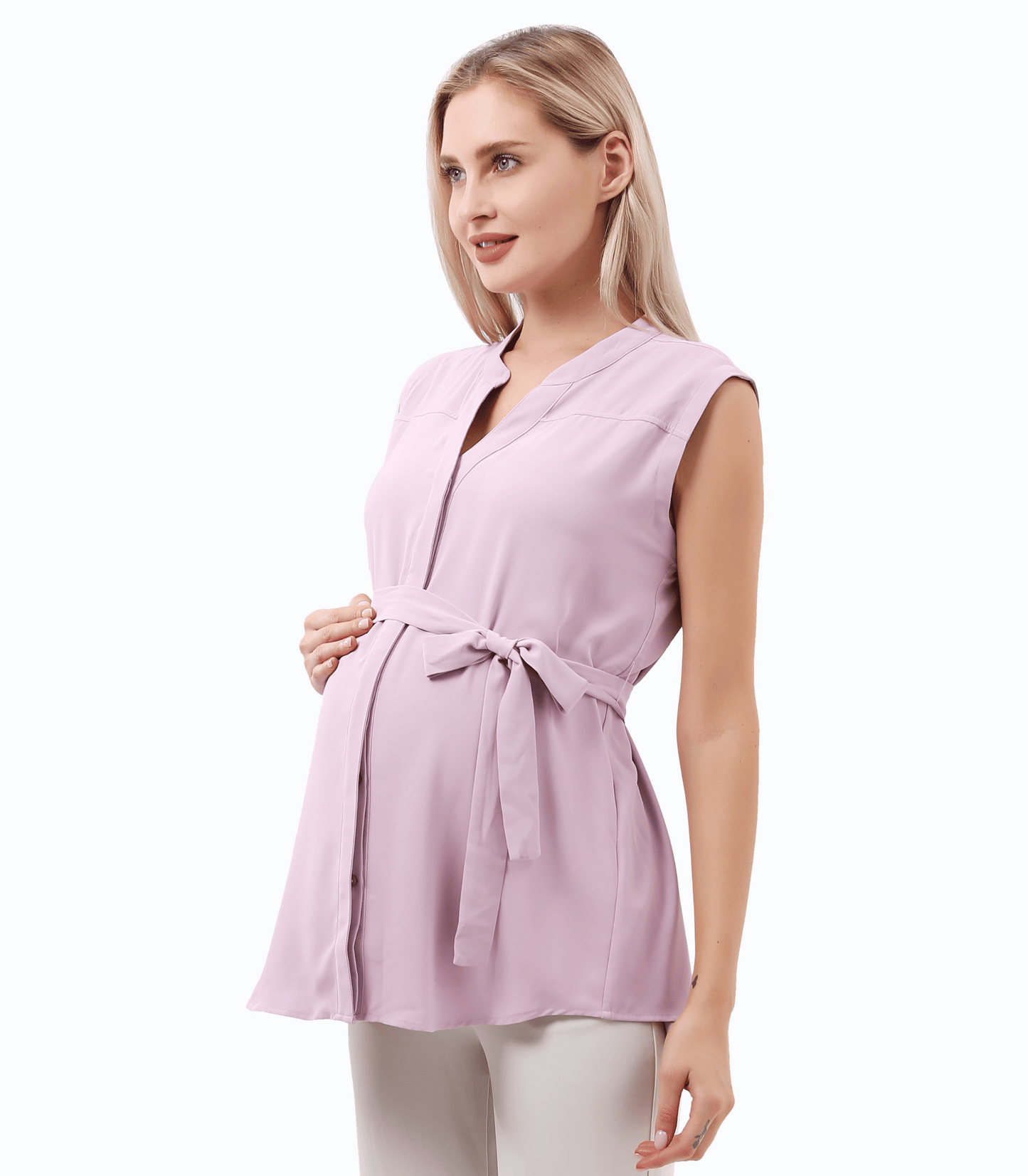 Woman wearing a light purple sleeveless top with a belt on a white background