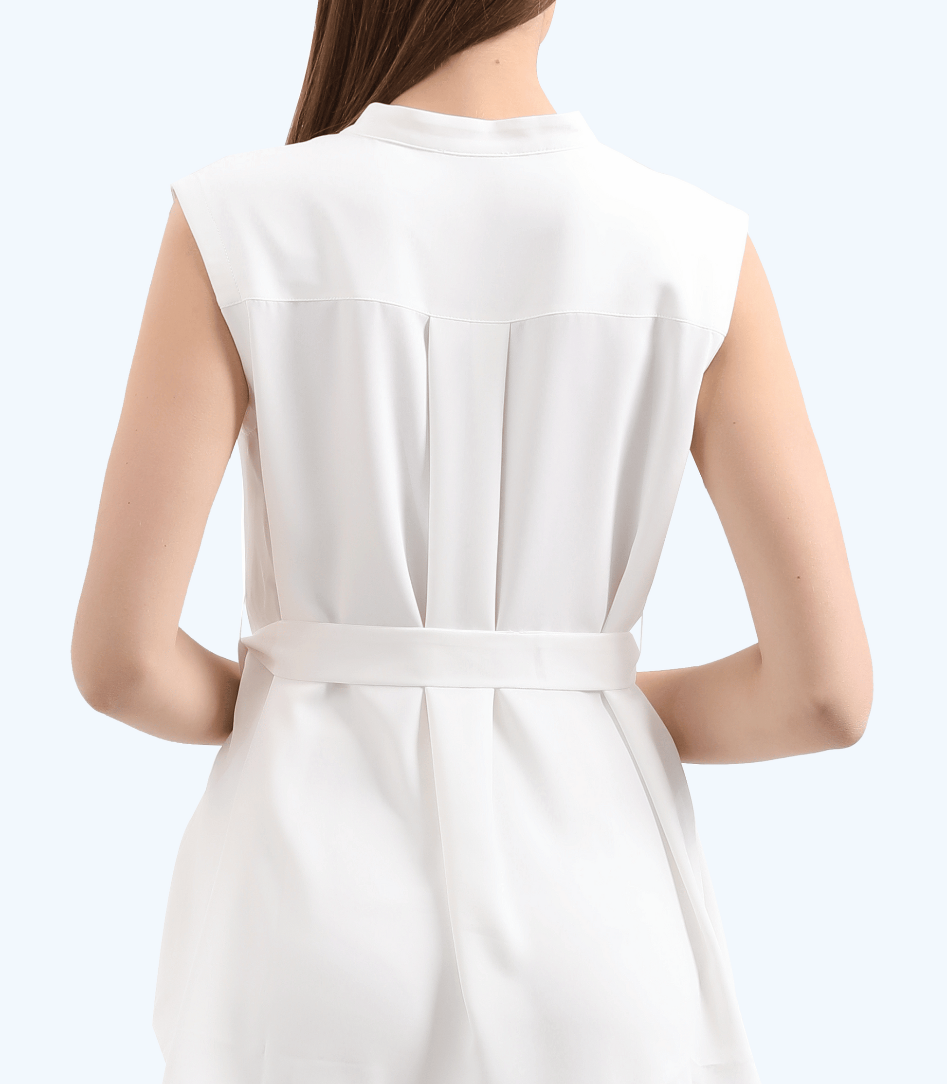 White sleeveless dress with a belt on a plain background