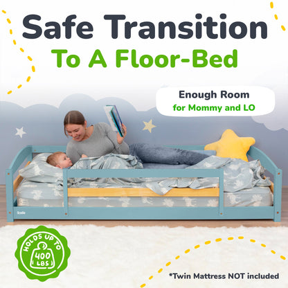 Woman reading to a child in a floor-bed with text about safe transition to a floor-bed.
