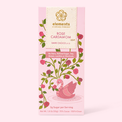 Pink packaging of Elements Rose Cardamom dark chocolate with floral design on a white background
