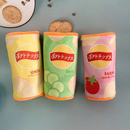 Three colorful potato chip packages with Japanese text on a gray surface.