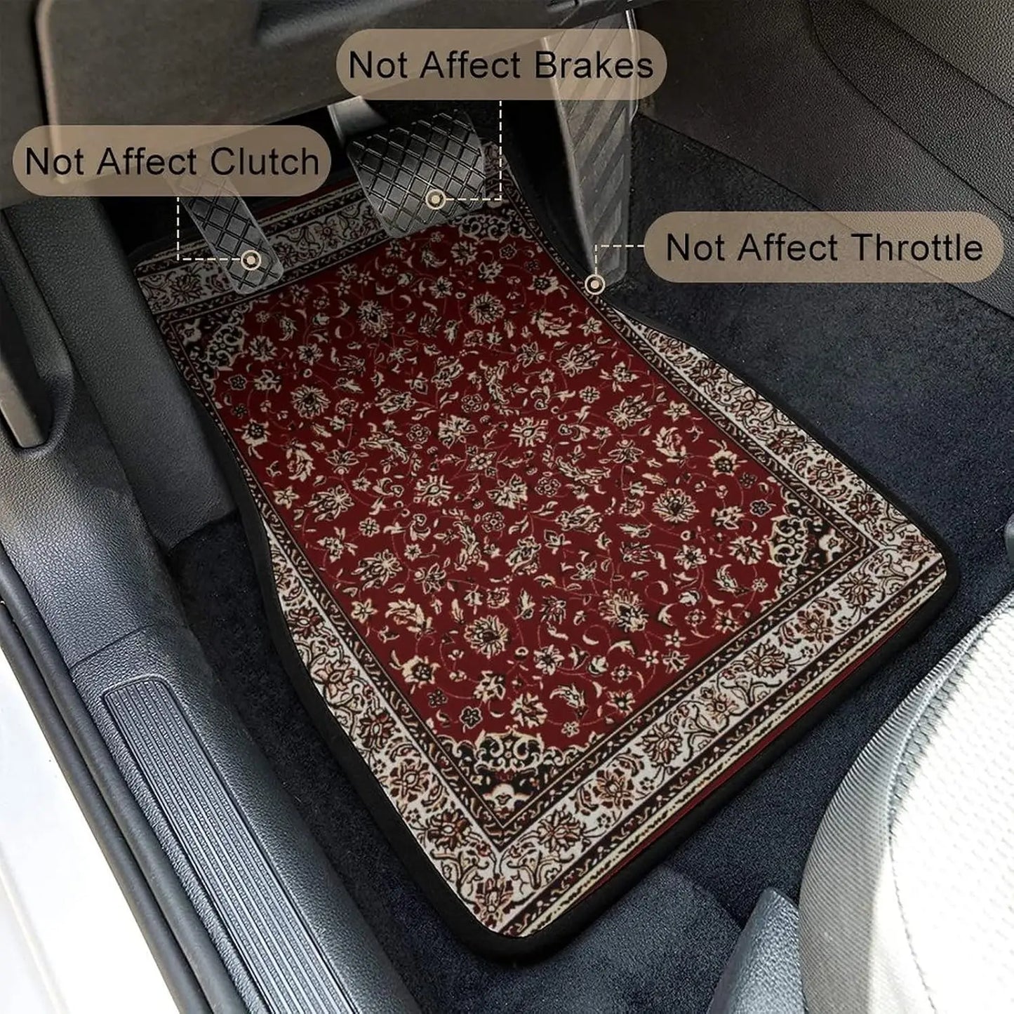 Car floor mat with floral pattern on a car's gray floor