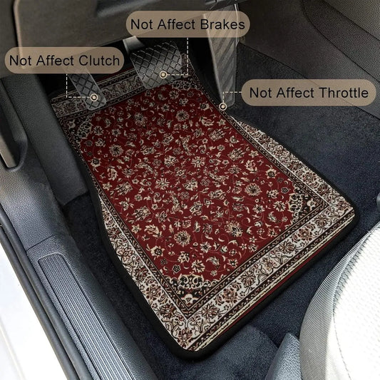 Car floor mat with floral pattern on a car's gray floor