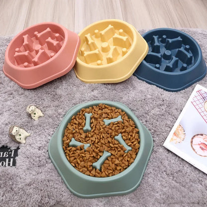 Four dog food bowls with bone-shaped slots on a carpeted floor.