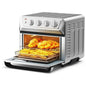 A silver countertop convection toaster oven air fryer dehydrator with a see-through door showing food inside, and control knobs on the top front.