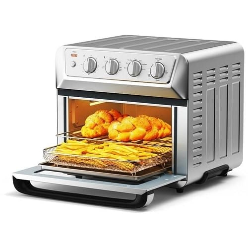 A silver countertop convection toaster oven air fryer dehydrator with a see-through door showing food inside, and control knobs on the top front.