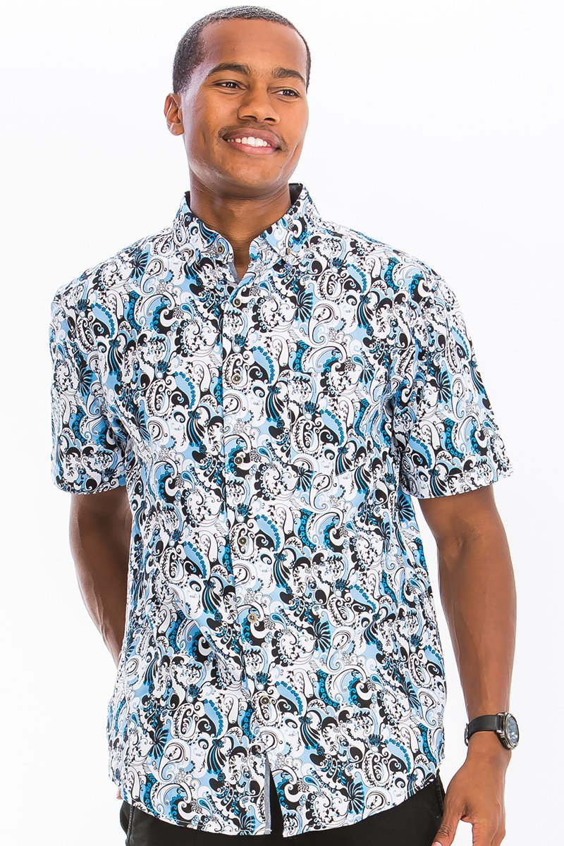 Man wearing a patterned shirt on a white background