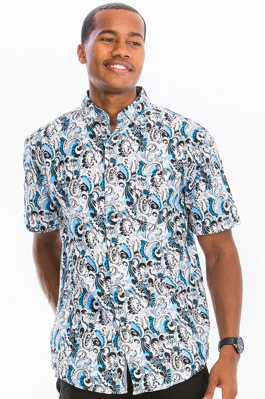 Man wearing a patterned shirt on a white background
