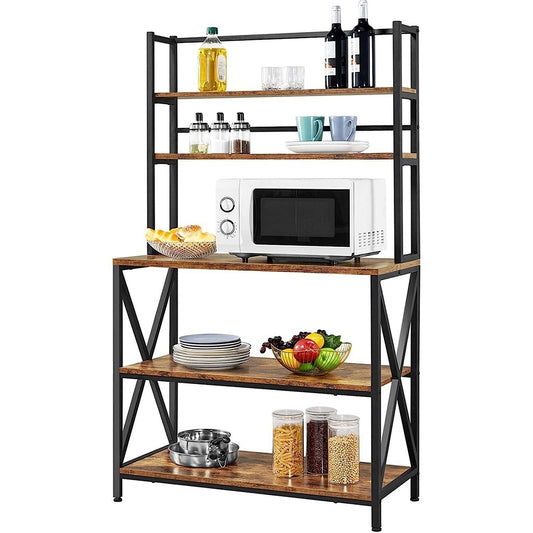 A modern industrial metal and wood bakers rack with five shelves, holding a microwave, pots, and other kitchen items.