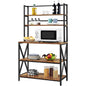 A modern industrial metal and wood bakers rack with five shelves, holding a microwave, pots, and other kitchen items.