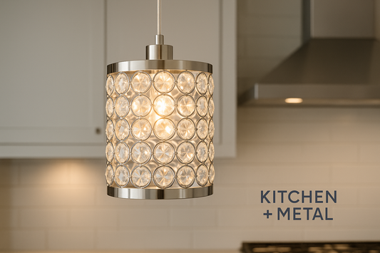 A crystal pendant lamp with metallic accents displayed against a modern kitchen background, featuring the Kitchen + Metal branding. The lamp's crystal elements create a warm, elegant glow that highlights the sophisticated blend of kitchen elements and metallic finishes, perfectly representing the Kitchen + Metal aesthetic.