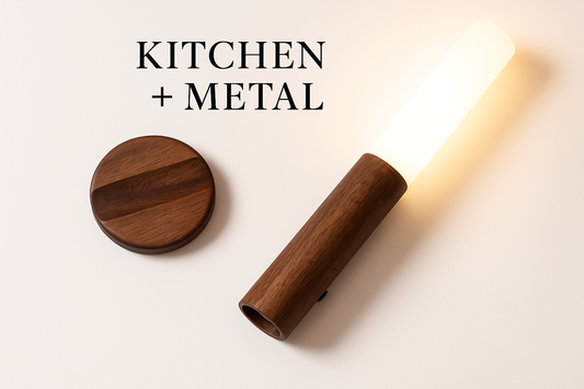 A minimalist wooden light fixture with a warm glowing light and circular wooden base, showcasing the natural wood grain and elegant design that embodies the Kitchen + Metal aesthetic.