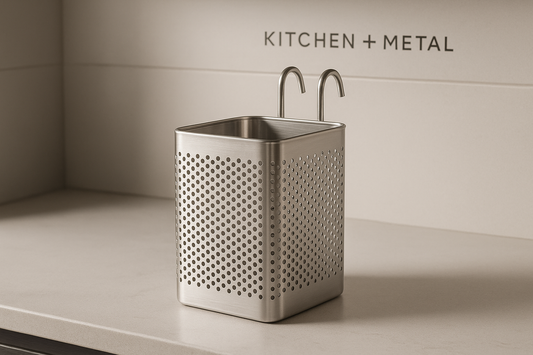 A sleek stainless steel kitchen utensil holder with a perforated design displayed on a modern kitchen countertop, embodying the premium Kitchen + Metal aesthetic