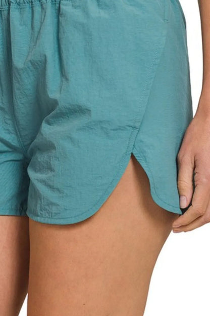 Zenana Windbreaker Smocked Waistband Running Shorts in Teal
