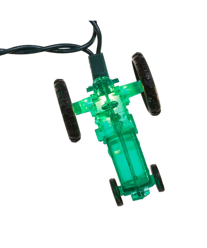 Green toy car with black wheels on a white background