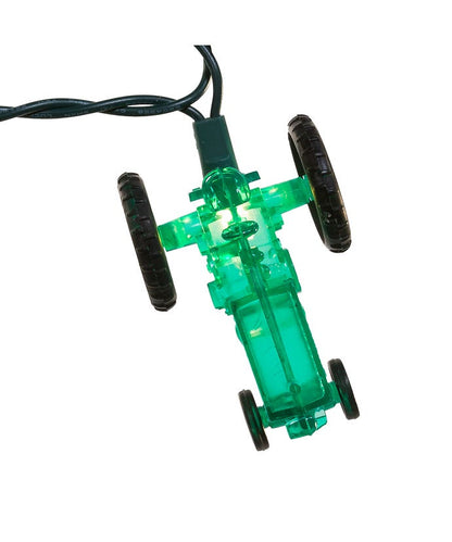 Green toy car with black wheels on a white background