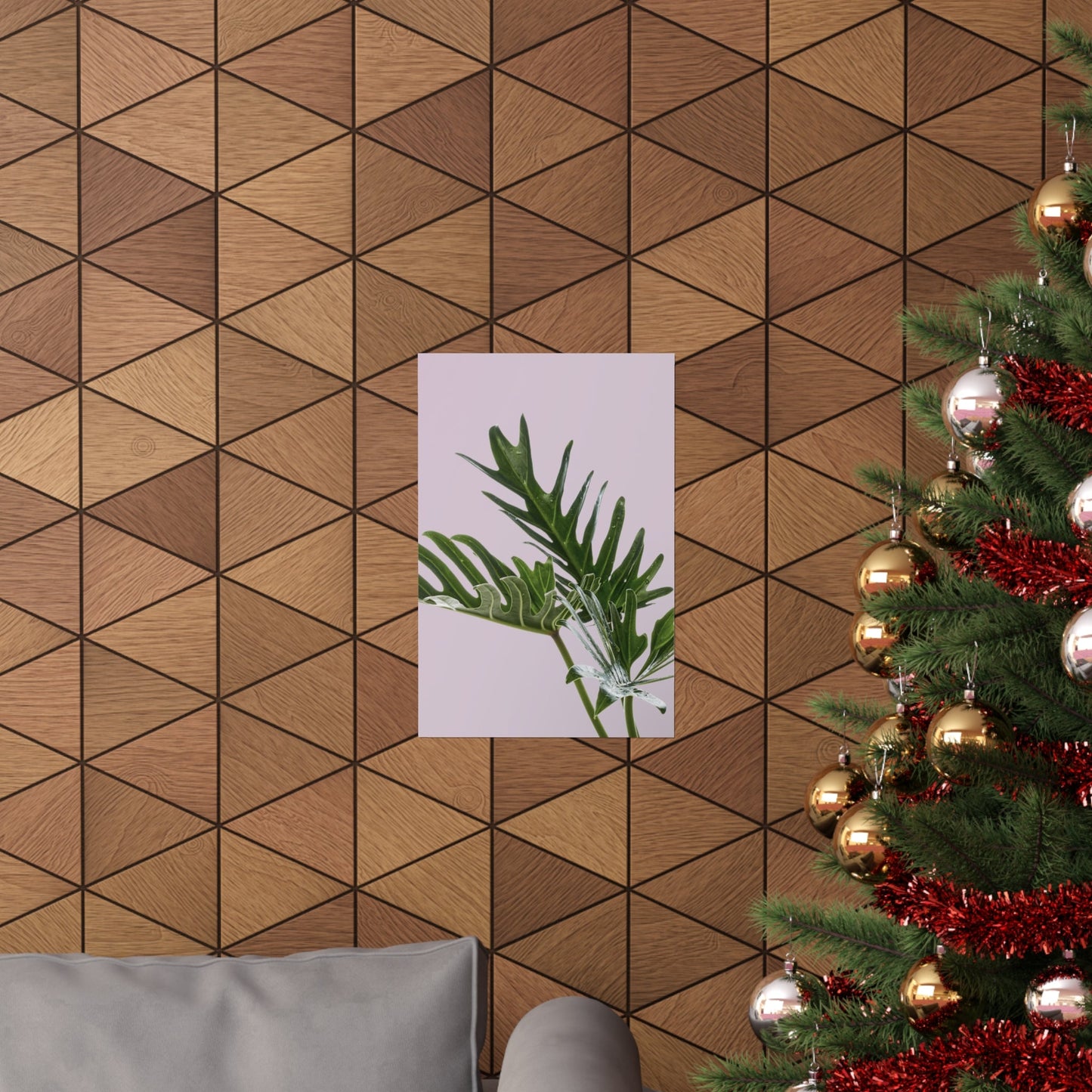 Wooden wall with geometric pattern, plant poster, and decorated Christmas tree.
