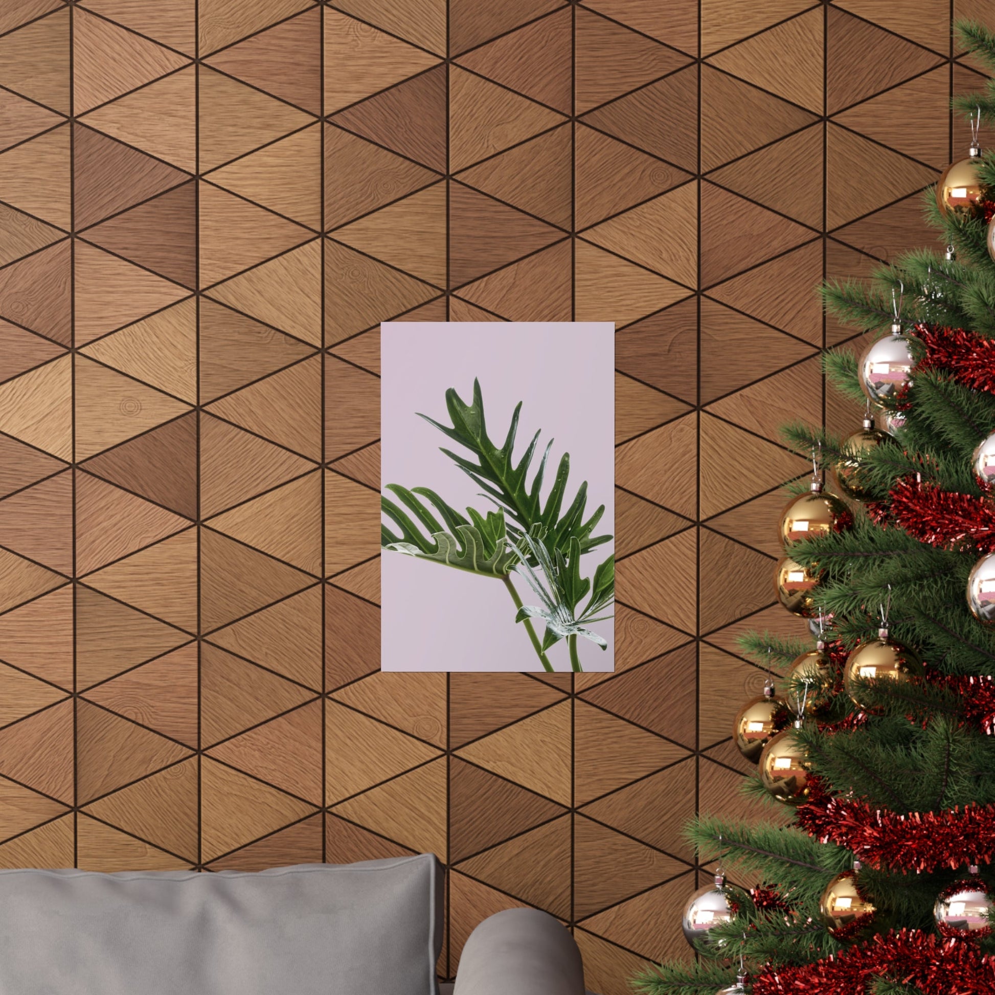 Wooden wall with geometric pattern, plant poster, and decorated Christmas tree.